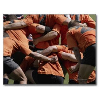 Male rugby players in scrum, rear view postcards