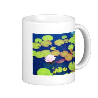 Pink Lotus Flower floating with lily pads on pond Coffee Mug