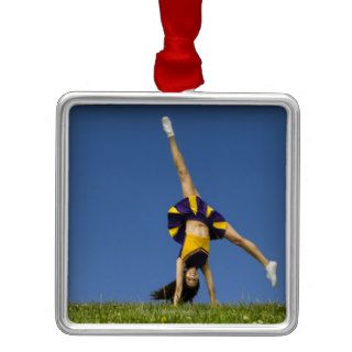 Female cheerleader doing cartwheel ornaments