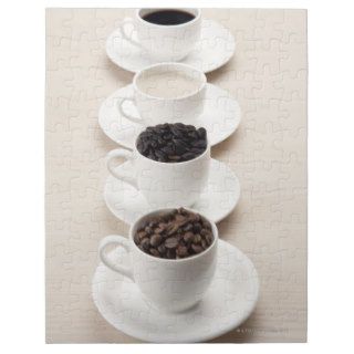 Close up of coffee and coffee beans on four cups jigsaw puzzles