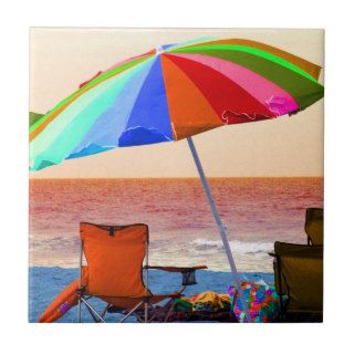 Colorful invert beach umbrella and chairs on Flori Tiles