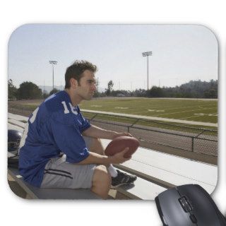 American football player sitting on bleachers mouse pad