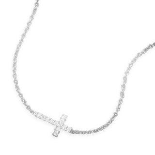 33734 7 7" + 1" extension rhodium plated sterling silver bracelet with clear CZ sideways cross. The CZ cross is approximately 11mm x 15mm. This bracelet has a spring ring closure. .925 Sterling Silver adjustable precious metal girl woman lady arm