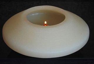 hollow floating wax candle lit by fuel cell by furnitoys