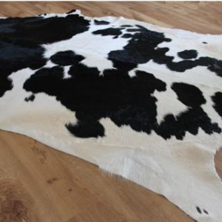 extra large monochrome cowhide rug by cowshed interiors