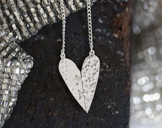 handmade silver sewn heart pendant by jemima lumley jewellery