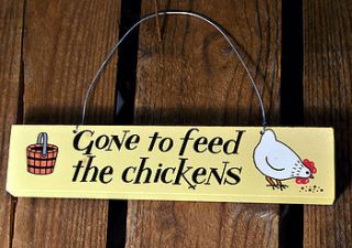 'gone to feed the chickens' wooden door sign by angelic hen