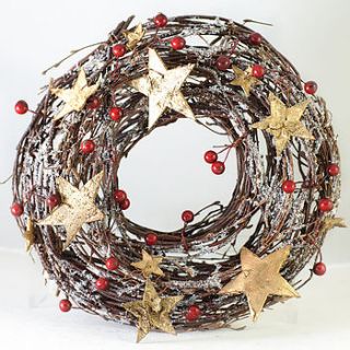 christmas wreath with gold stars by the orchard