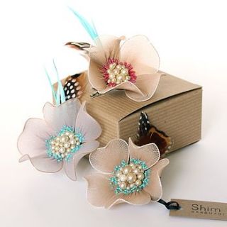 pearly centre corsage with feathers by shim sham