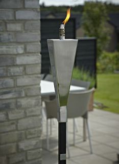 set of six shiny steel garden torches by posh garden furniture