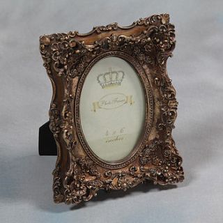 gold rococo photo frame by daisy west
