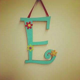 personalised curly wooden wall letters by loving luxuries