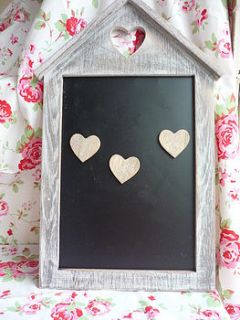 lime wash chalkboard with heart magnets by the dizzy flea