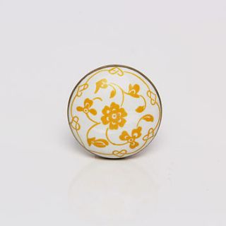 white and yellow ceramic floral dance knob by trinca ferro