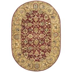 Handmade Classic Red/ Gold Wool Rug (76 X 96 Oval)