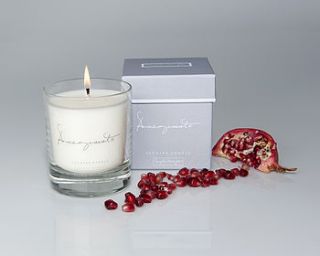 pomegranate scented candle in a glass by sophie allport
