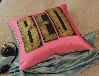 pink 'bed' wooden lettering silk cushion by judy holme