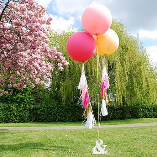 giant round tasselled helium balloons by eagle eyed bride