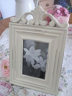 cream pretty carved frame by the hiding place