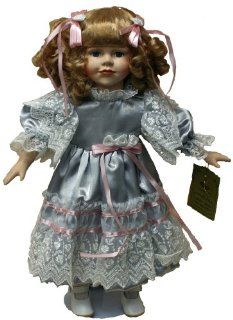 Standing Porcelain 18 Inches Doll with Curly Blond Hair and Blue Satin Dress with Lace Edging and Pink Ribbons Toys & Games