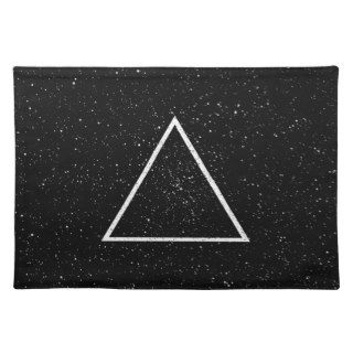 White triangle outline on black star background placemat