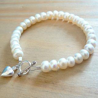 grade a button freshwater pearl with silver heart charm bracelet by clutch and clasp