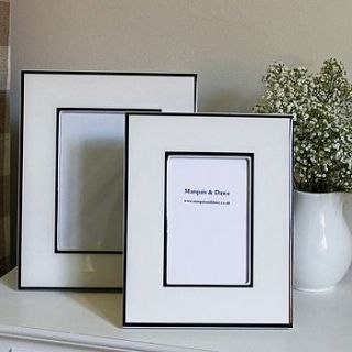 white and black photograph frame by marquis & dawe